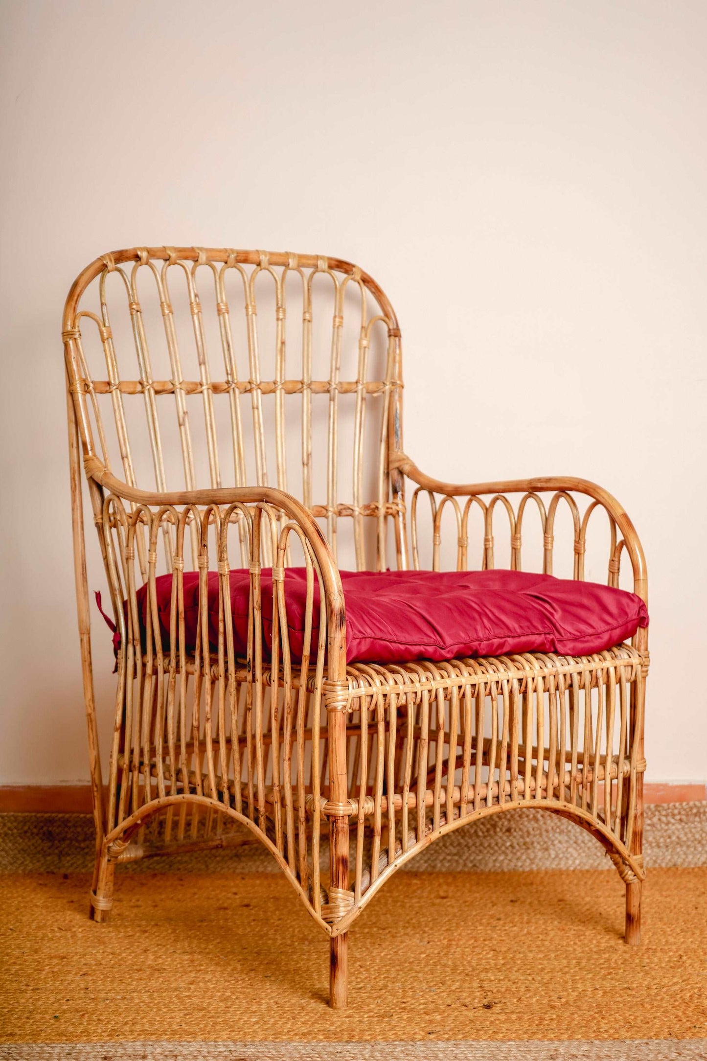 Wicker loop chair with only seat cushion included.