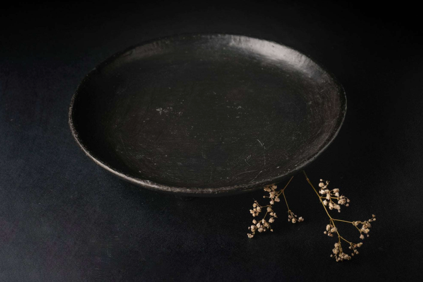 Longpi Black Pottery Stoneware multipurpose serving platter with a trivet leg